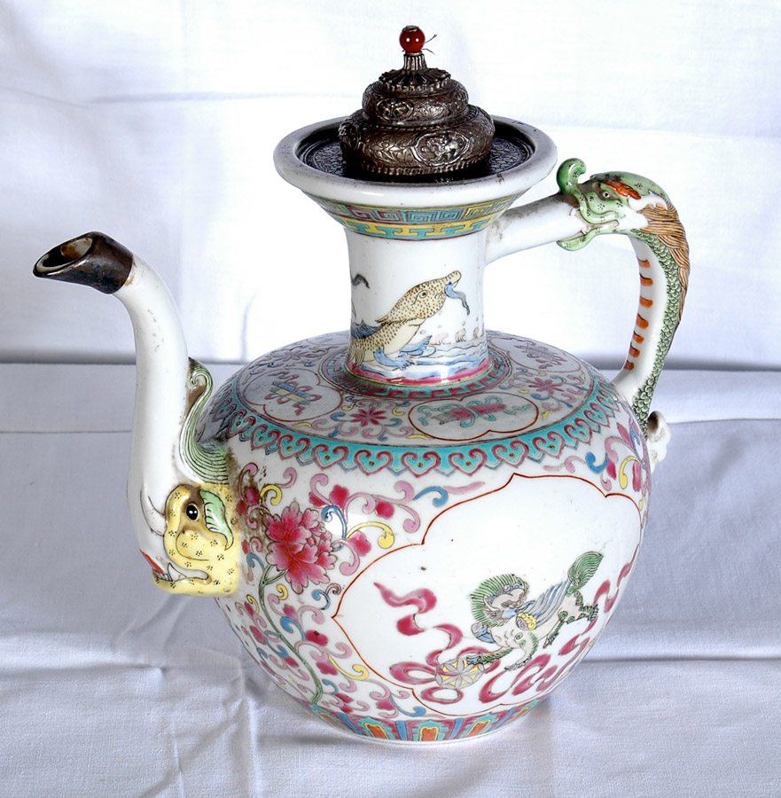Rare form of a Tibetan tea-pot in the shape of the Makara with lion and other traditional auspicious symbols