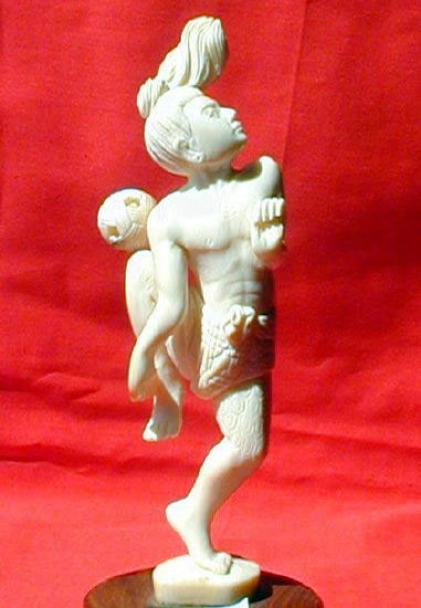 A cane-ball player, carved in the naturalistic syle