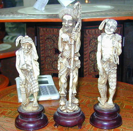 Fishermen carved by U Win Maung and lightly stained