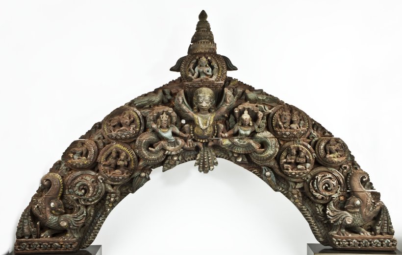 CATALOGUE NO. 29 WOODEN TYMPANUM WITH A GARUDA AND NAGAS