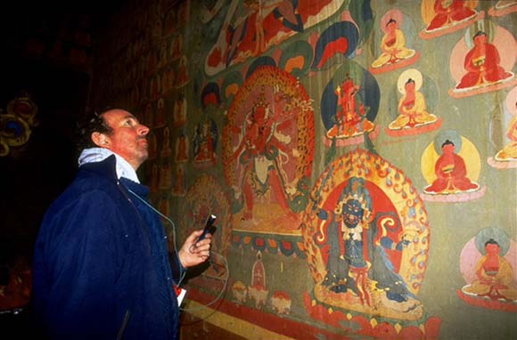 John Sanday inspects damaged murals at Baiya Monastery.