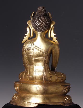The Crowned Buddha represents Buddhahood rather than a specific Buddha such as the Buddha of our world age, Shakyamuni.