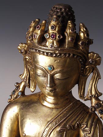 The Crowned Buddha represents Buddhahood rather than a specific Buddha such as the Buddha of our world age, Shakyamuni.
