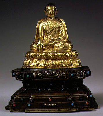 Seated lama on a lotus base