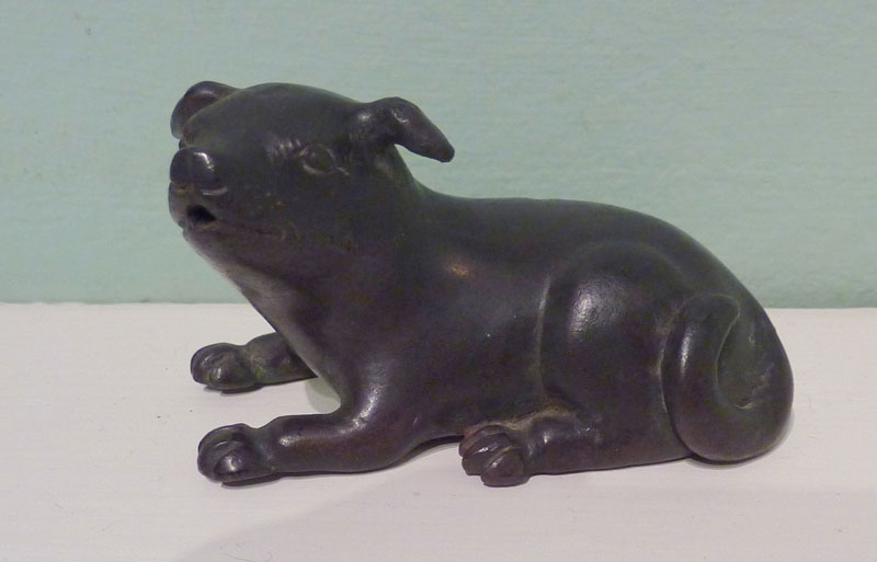 A bronze water-dropper modelled as a puppy