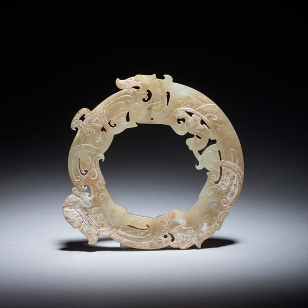 Jade circular disc, <em>huan</em>, with dragon motifs