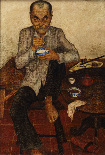 Chinese man eating rice in a room with teapot and opium set