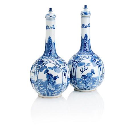 A good pair of Kangxi-revival bottle vase and covers