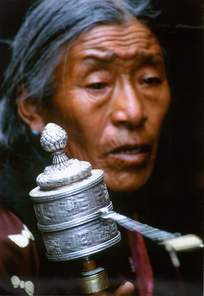 Tibetan woman with Prayer Wheel