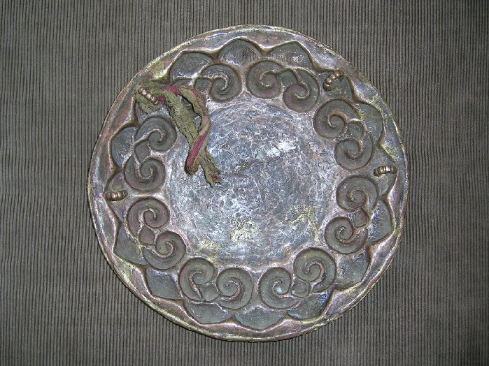 A gilt bronze ritual mirror