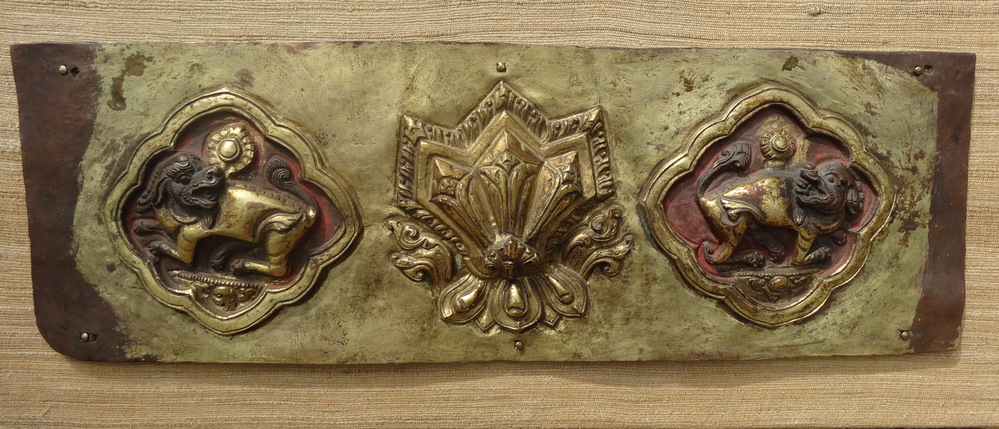 Two lions and the three jewels in copper repoussé fire gilded