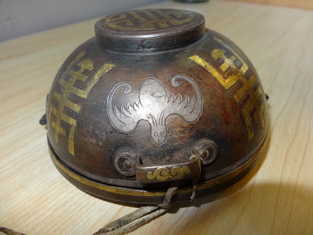 A cup holder in iron, partially silvered and gilded