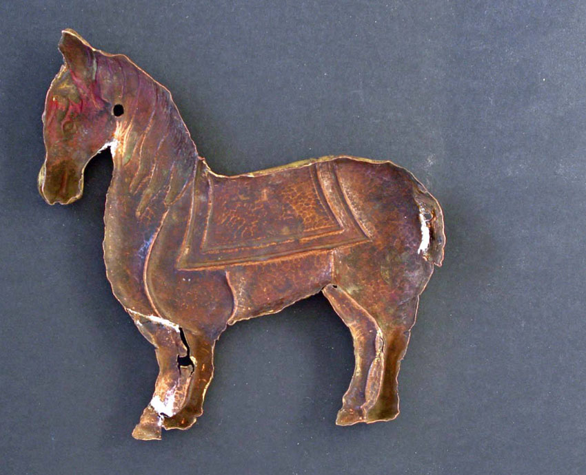 Embossed gilt copper plate, representing a Horse