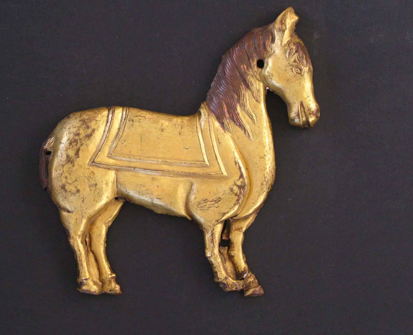 Embossed gilt copper plate, representing a Horse