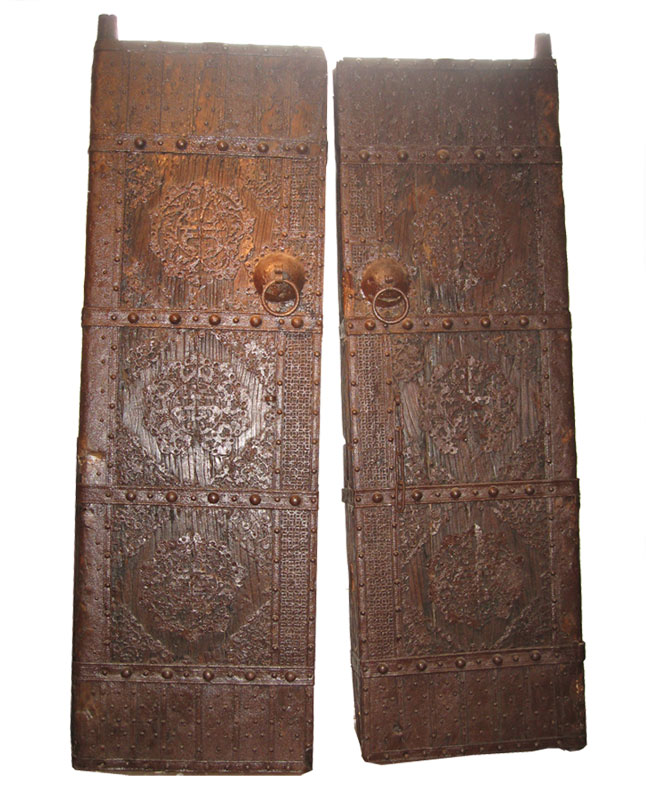 One pair of exceptional and rare antique compound doors with original elaborate iron fitting