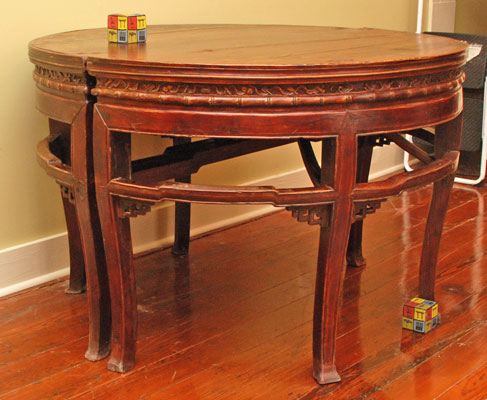 Two demilune tables which join together to form circular table