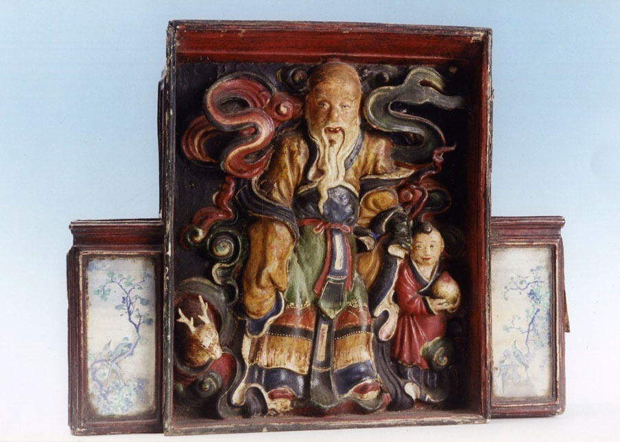 A Chinese Polychrome dry-lacquer box depicting the God of Longevity