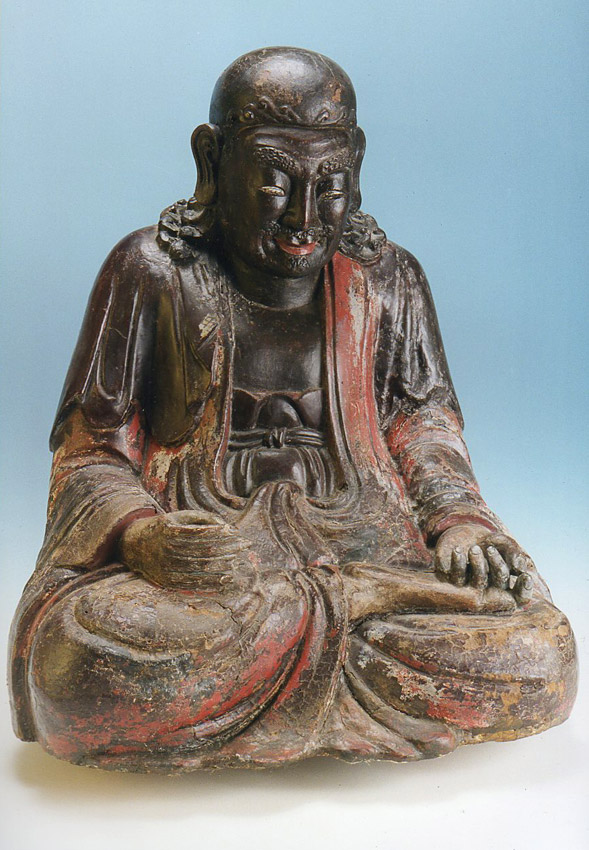 A Carved, lacquered wooden image of a Luohan