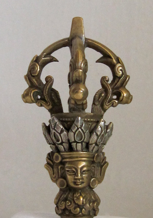 A Fine Bronze and Silver  Bell Handle