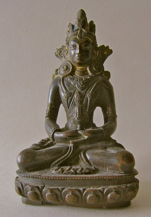A dark bronze image of Amitayus