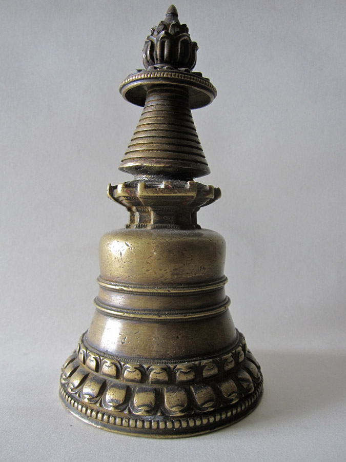 A bronze image of a chorten