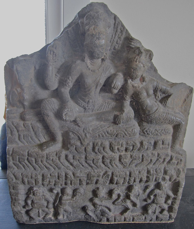 A carved stone stele, depicting Uma-Mahesvara