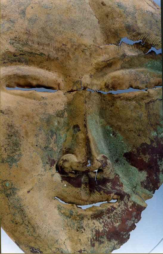 A copper funerary mask