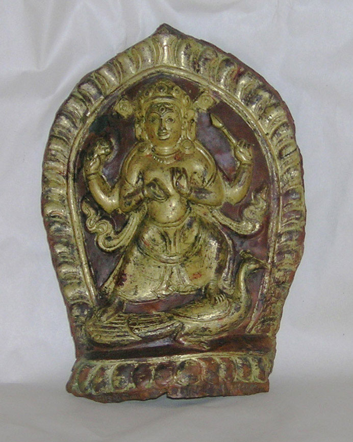 A gilt copper and cold gilded repousse plaque depicting Kaumari