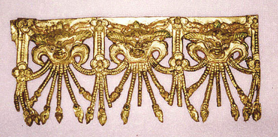 A gilt copper repousse decorative border