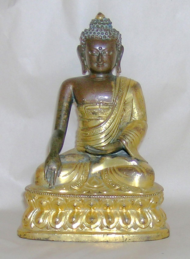 An inscribed parcel gilt repousse image of the Buddha