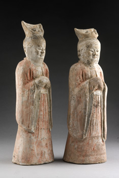 A pair of court attendants wearing a mask