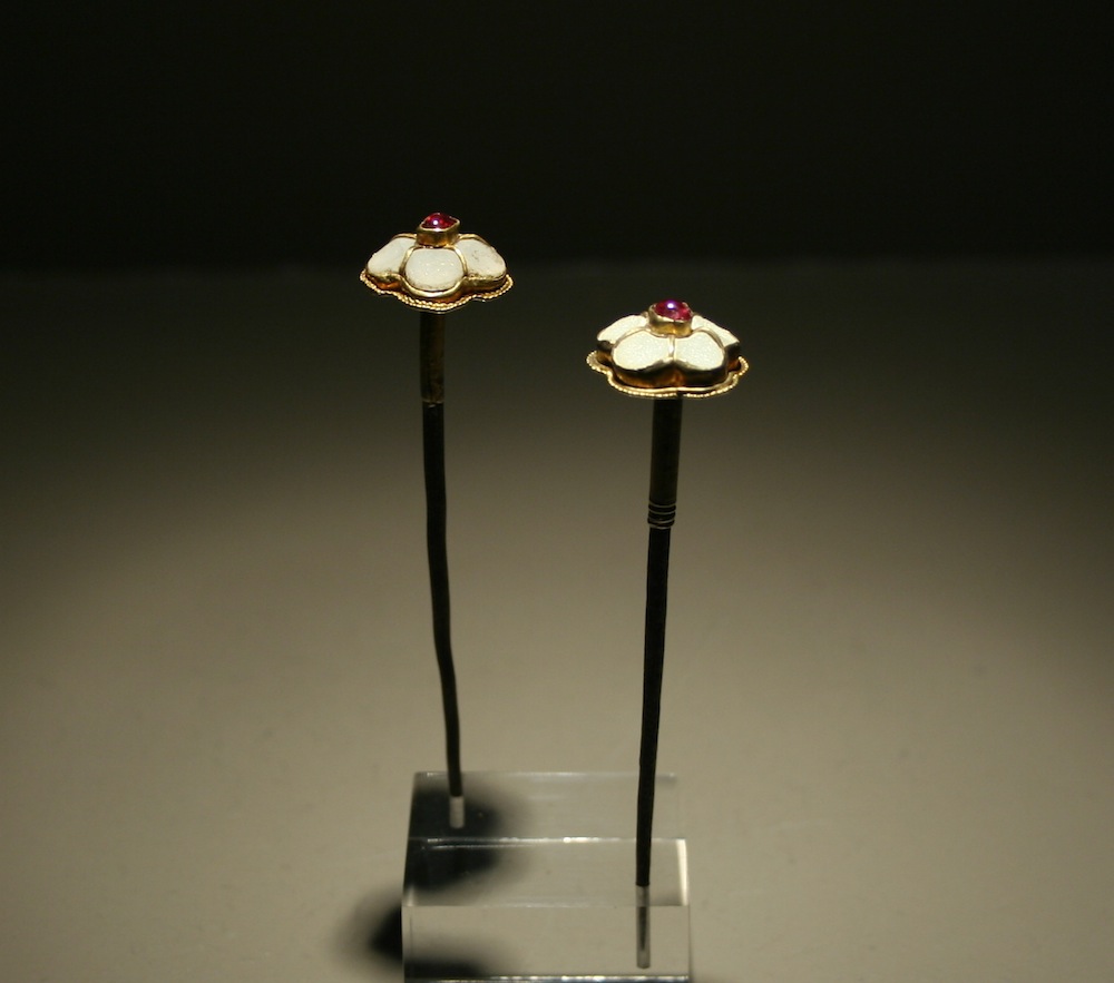 A pair of hairpins in the shape of plum flowers