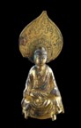 A small votive figure of Buddha
