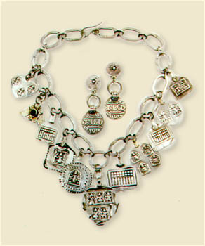 Necklace of silver Indian amulets and earrings of old coins