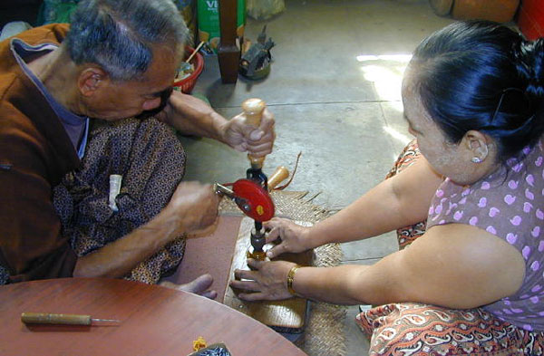 Most figurines are mounted on wooden stands