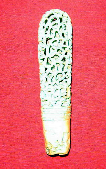 <i>Kun char</i>, filigree with a small Buddha within.