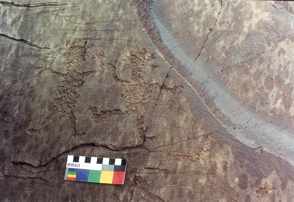  Petroglyph portraying figures which appear to be dancing