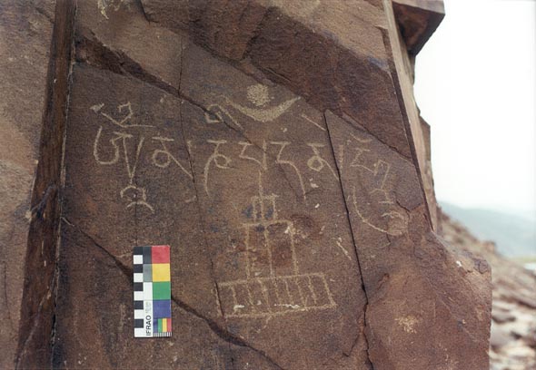  Ma-ni mantra and early style stupa carving