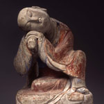 Stone carving of a sleeping luohan