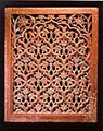 A large sandstone jali screen