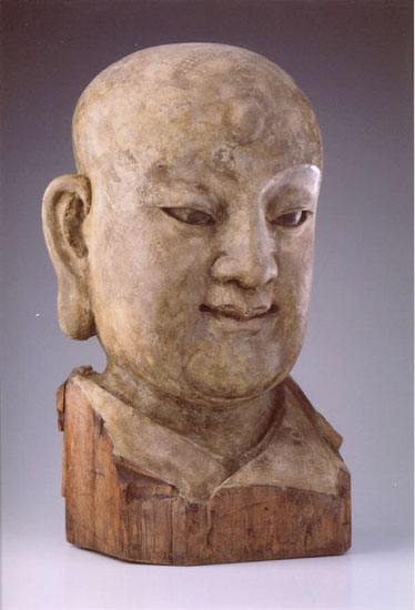 A wood head of a Louhan