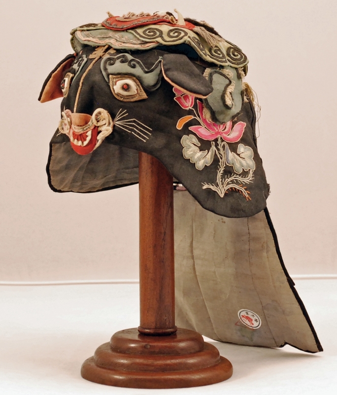 Antique Asian Decor: Late 19th century silk Chinese child's hat - black tiger with green dragon from Northern China