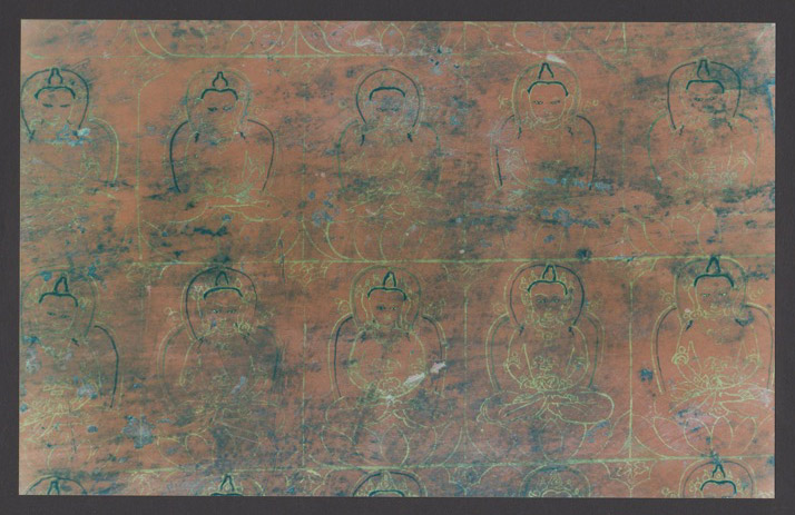 A red and gold lacquered manuscript cover