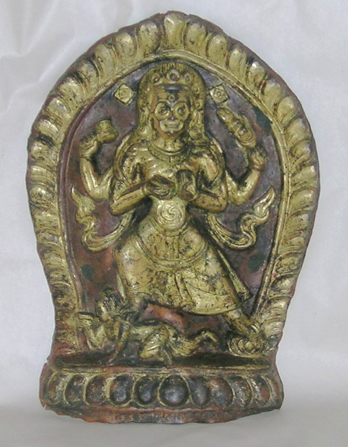 An inscribed copper gilt plaque